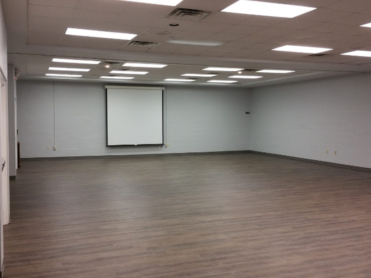 Empty commercial meeting room after a full interior repaint